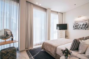 מיטה או מיטות בחדר ב-מלון 65, רוטשילד תל-אביב - מלון בוטיק מרשת אטלס