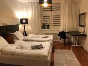 Posteľ alebo postele v izbe v ubytovaní Pension Skylark