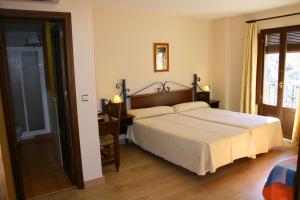 Posteľ alebo postele v izbe v ubytovaní Hotel Rural Huerta del Laurel