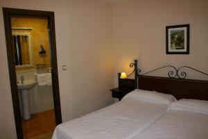 Posteľ alebo postele v izbe v ubytovaní Hotel Rural Huerta del Laurel