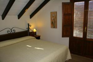 Posteľ alebo postele v izbe v ubytovaní Hotel Rural Huerta del Laurel