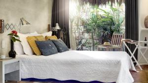 Cama ou camas em um quarto em The Chili Beach Private Resort