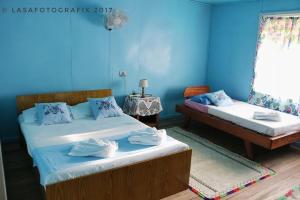 מיטה או מיטות בחדר ב-Myrie's Homestay