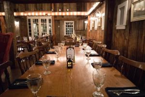 a long table in a restaurant with glasses on it at The Grafton Inn in Grafton