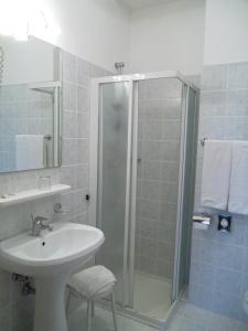 a bathroom with a shower and a sink at Hotel Alla Dolina in Sistiana