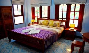 Postel nebo postele na pokoji v ubytování Majestic Villas Phuket