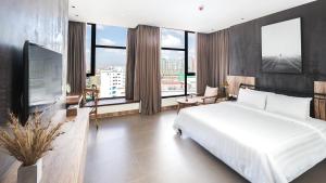 Postel nebo postele na pokoji v ubytování SIM Boutique Hotel