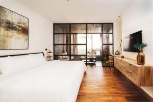 Postel nebo postele na pokoji v ubytování SIM Boutique Hotel