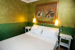 Postel nebo postele na pokoji v ubytování Hotel Diana