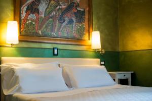 Postel nebo postele na pokoji v ubytování Hotel Diana