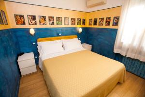Postel nebo postele na pokoji v ubytování Hotel Diana