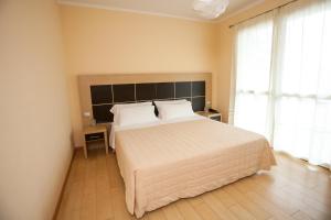 Postel nebo postele na pokoji v ubytování Hotel Diana