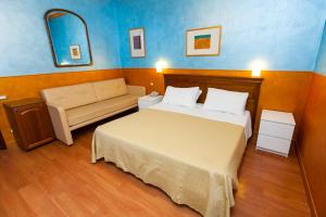 Postel nebo postele na pokoji v ubytování Hotel Diana