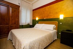 Postel nebo postele na pokoji v ubytování Hotel Diana