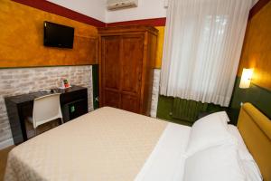 Postel nebo postele na pokoji v ubytování Hotel Diana