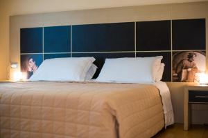 Postelja oz. postelje v sobi nastanitve Hotel Diana