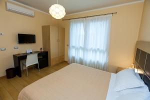 TV a/nebo společenská místnost v ubytování Hotel Diana