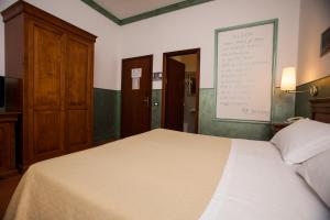 Postel nebo postele na pokoji v ubytování Hotel Diana