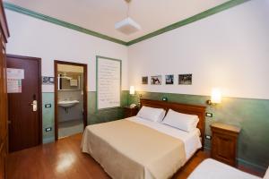 Postel nebo postele na pokoji v ubytování Hotel Diana