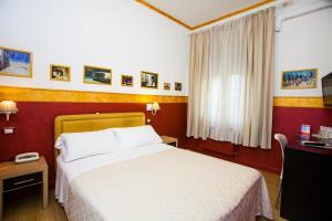 Postel nebo postele na pokoji v ubytování Hotel Diana