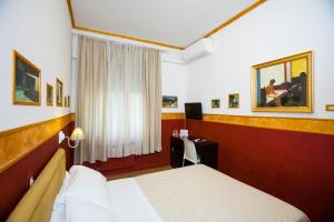 Postel nebo postele na pokoji v ubytování Hotel Diana