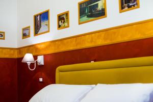 Postel nebo postele na pokoji v ubytování Hotel Diana