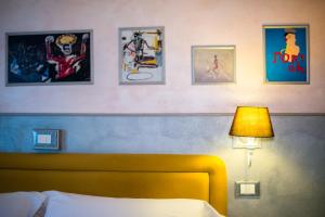 Postel nebo postele na pokoji v ubytování Hotel Diana