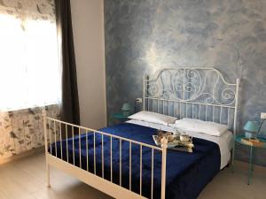 Ένα ή περισσότερα κρεβάτια σε δωμάτιο στο La casa al mare di Ale e Dade