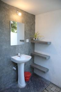 a bathroom with a sink and a mirror at THE CLASSIC-Hostel-apartment-Standard Room in Weligama