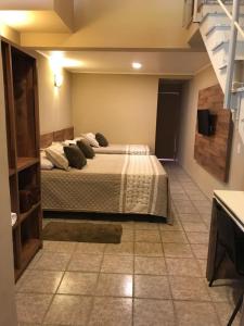 Cama ou camas em um quarto em Amoreiras Hotel Pousada