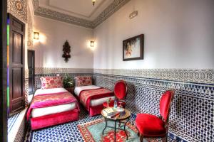 Postel nebo postele na pokoji v ubytování Riad El Amine Fès - Historic Hotels Worldwide