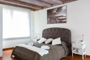 a bedroom with a large bed and a window at The Royal Story in Rome