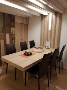 a dining room with a table and chairs at Apartman View in Bjelašnica