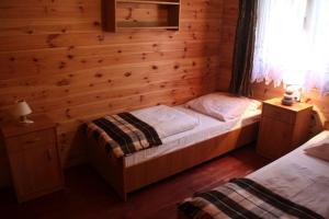 Кровать или кровати в номере Ośrodek Portus