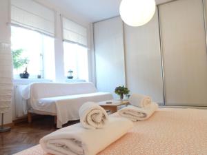 a room with two massage beds and towels on the floor at Apartment Maya's in Zagreb