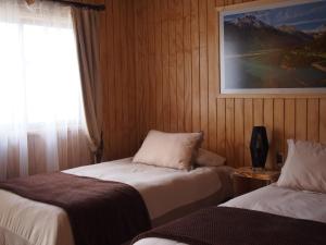 Hotel Último Paraíso客房内的一张或多张床位