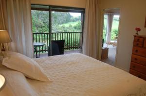 Te Awa Lodge tesisinde bir odada yatak veya yataklar