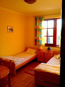 Ένα ή περισσότερα κρεβάτια σε δωμάτιο στο 5 Puttonyos Vendégház