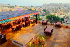 an overhead view of a restaurant with tables and chairs at Tripli Hotels Prithvi Palace in Jaisalmer