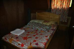 מיטה או מיטות בחדר ב-Highland Inn and Restaurant
