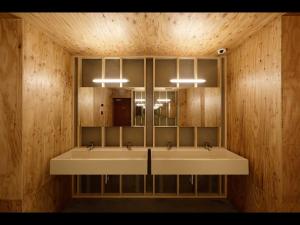 a bathroom with two sinks and a mirror at Do-c Shibuya Ebisu in Tokyo