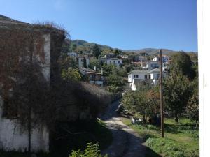 a winding road through a small town with houses at Beautiful cottage in Zagora in Zagora