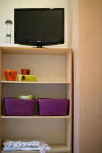 TV a/nebo společenská místnost v ubytování Easy Loft