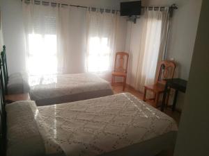 Letto o letti in una camera di Hotel Delphos