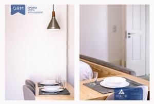 a dining room table with plates and glasses on it at ORM - 3 C´s Apartments in Porto