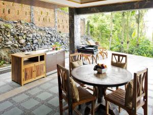 a kitchen and dining room with a table and chairs at Thara Bayview Villa, SHA Certified in Ao Nang Beach