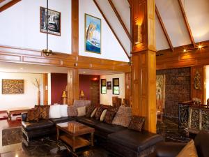 a living room with a couch and a table at Thara Bayview Villa, SHA Certified in Ao Nang Beach