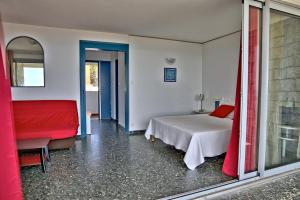 Postel nebo postele na pokoji v ubytování Hotel la Parata