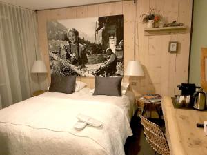 A bed or beds in a room at Boutique-Hôtel Chez Jan