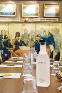 a table with a bottle of water on top of it at Victory Apartments in Stockholm